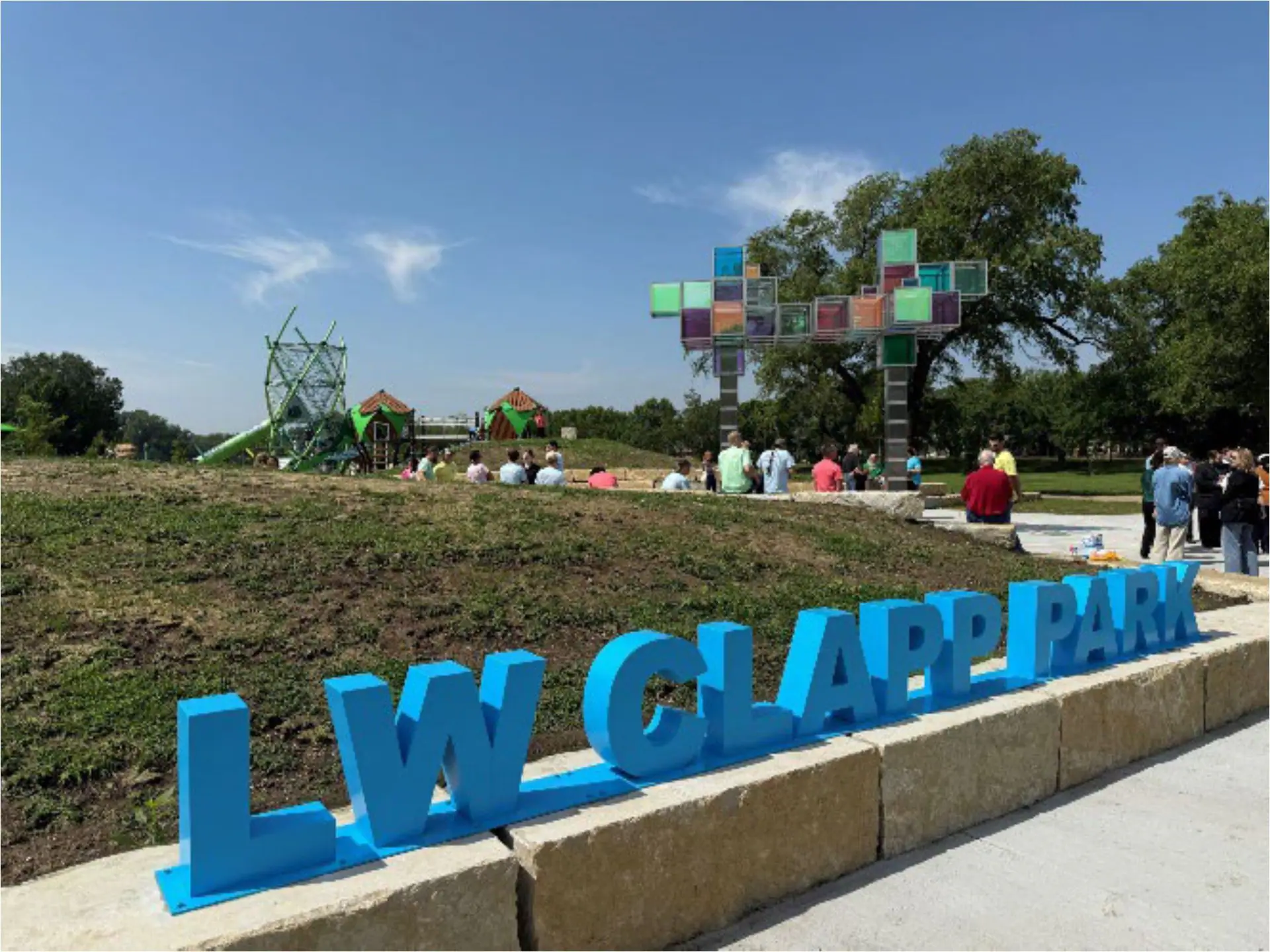 Playground area and sign at L.W. Clapp Memorial Park in Wichita