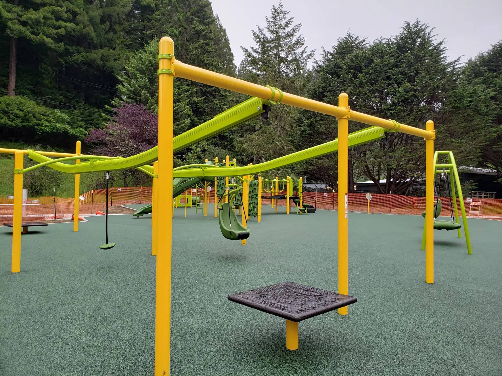 Inclusive playground platform and zip-line-style feature at Freshwater Park in Eureka
