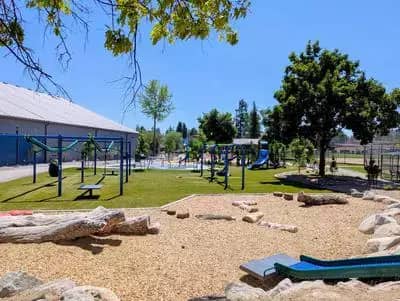 Travers Park Playground in Sandpoint with colorful modern inclusive play equipment