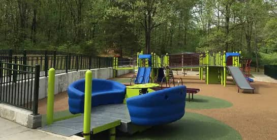 Inclusive playground structure at Woodridge Park in Columbia