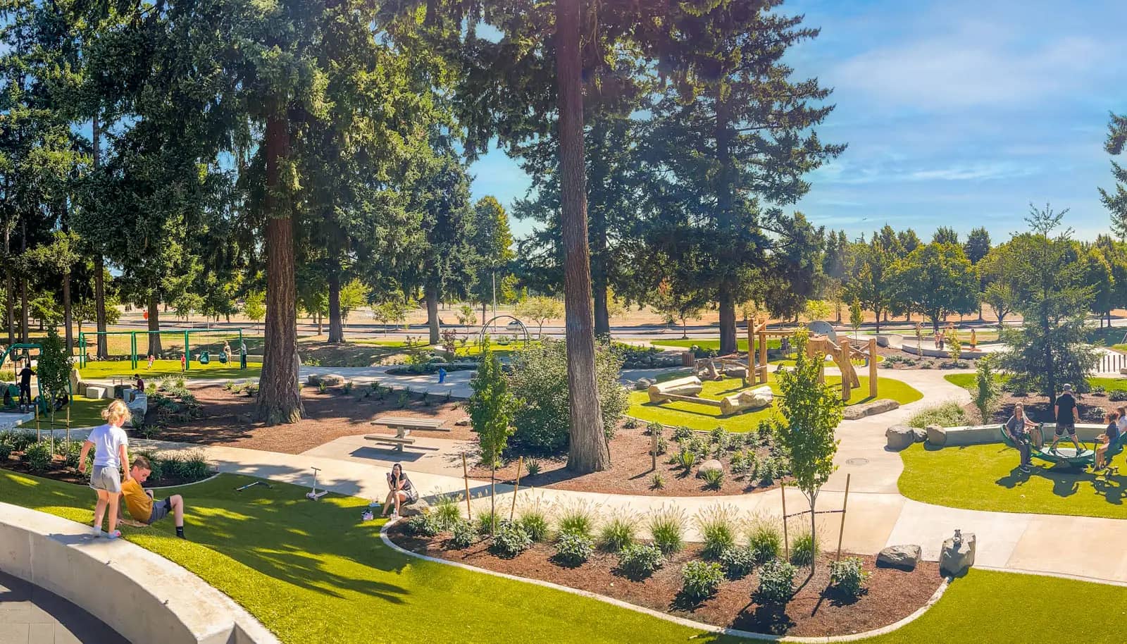 Inclusive play structure at Marshall Park in Vancouver with accessible pathways and elevated play elements.