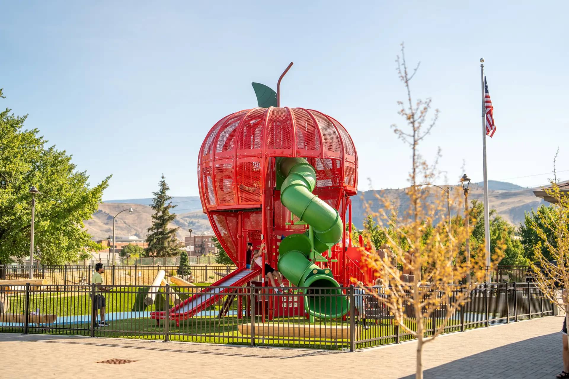 Apple-themed inclusive playground structure at Wenatchee Riverfront Park