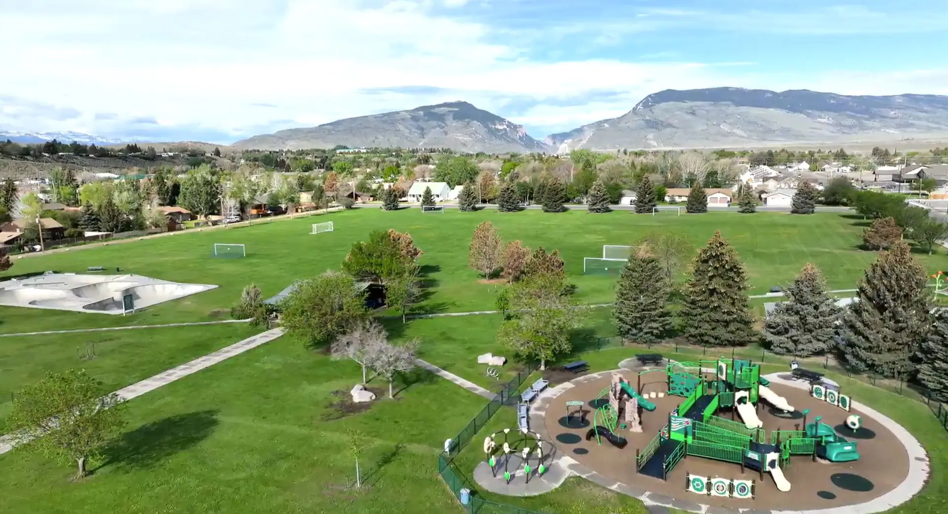 Mentock Park in Cody with open family recreation space and inclusive playground area