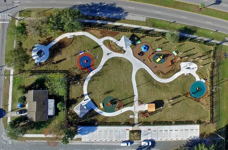 Inclusive playground structures and accessible surfacing at SENSES Park in Kissimmee